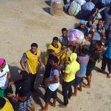 Mormon_missionaries_help_unload_donated_goods_for_HaapaiE